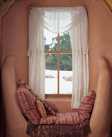 
Overstuffed pillows invite reading or catnapping in the snug windowseat.
